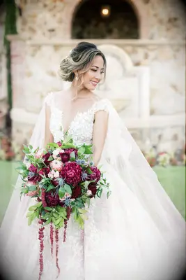 Loose updo with curled hanging strands