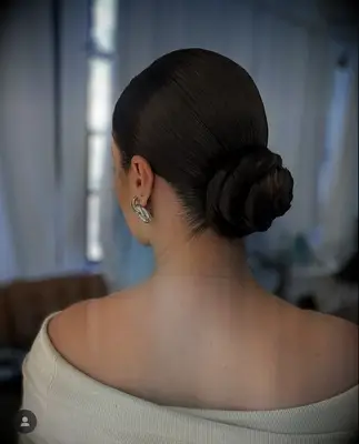Sleek low bun bridesmaid hairstyle
