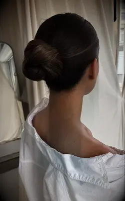 Sleek pretzel bun bridesmaid hairstyle