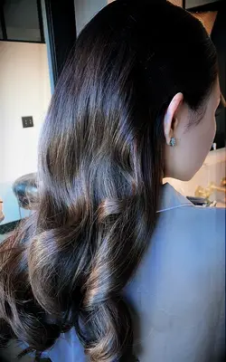 Classic curls with pinned sides bridesmaid hairstyle