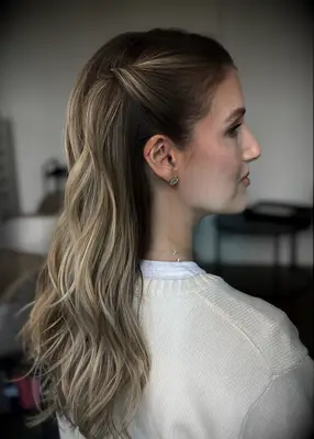 Beachy waves with twisted side strands bridesmaid hairstyle