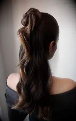 Half-up half-down waves with a twist bridesmaid hairstyle