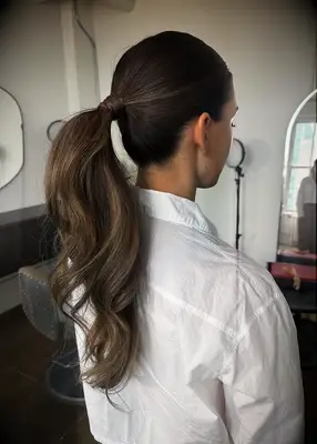 Bouncy wraparound ponytail bridesmaid hairstyle