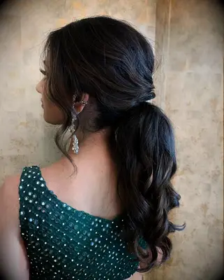Touseled low ponytail wedding hairstyle