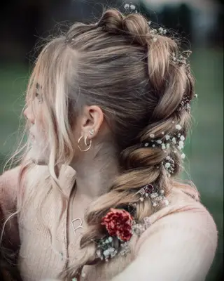 Braided ponytail with fresh flowers wedding hairstyle