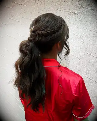 Side-swept fishtail braid high ponytail wedding hairstyle