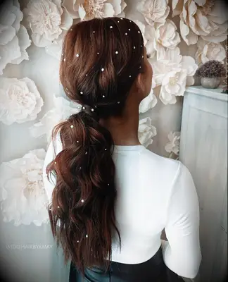 Low ponytail with pearls wedding hairstyle