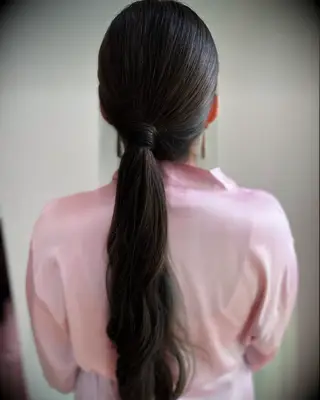 Relaxed low ponytail wedding hairstyle
