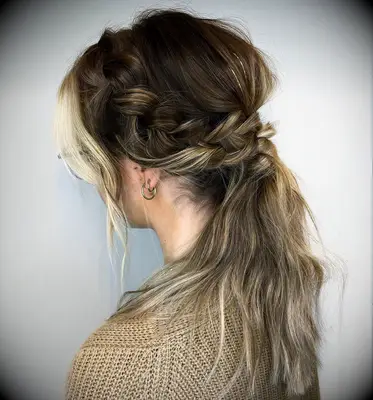 Textured ponytail with side braid wedding hairstyle