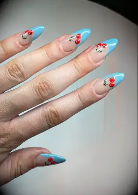 pale blue and bright red cherries nail inspo