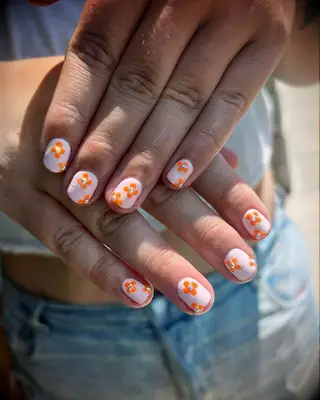 orange flower wedding nail inspo