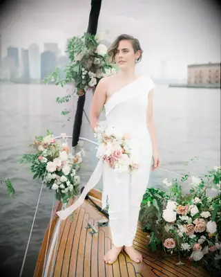 Side swept bang one shoulder gown bridal hairstyle