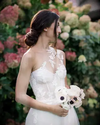 Twisted updo one shoulder gown bridal hairstyle