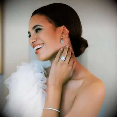 Low bun one shoulder bridal hairstyle