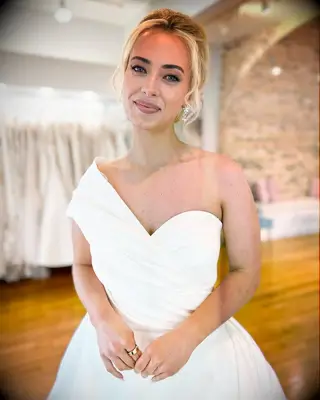 Bridal hairstyle updo for one shoulder gown