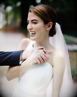 Chic Chignon with Veil one shoulder gown bridal hairstyle