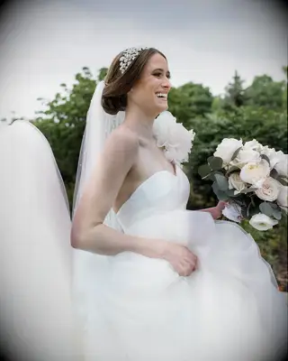 Updo with a Crystal Headpiece one shoulder gown bridal hairstyle