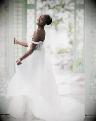 Briaded bun one shoulder gown bridal hairstyle