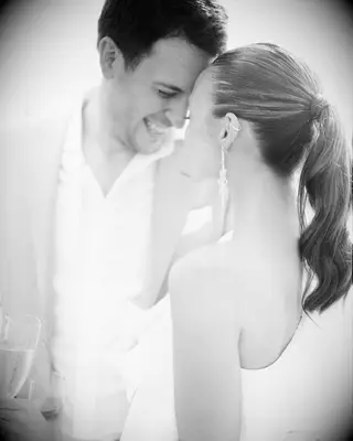 Sleek ponytail one shoulder gown bride hairstyle