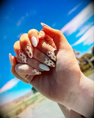 Brown cow print engagement nail inspiration