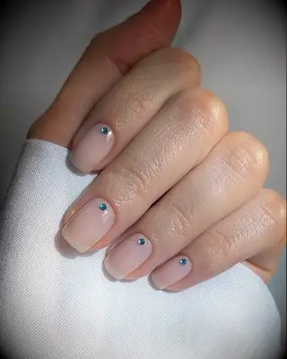 Sheer natural wedding nails with blue bling