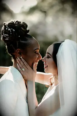 Neutral almond wedding nails with embellishments