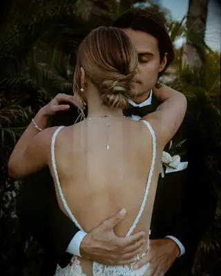 Textured low bun wedding hairstyle