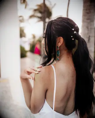 Elevated ponytail wedding hairstyle