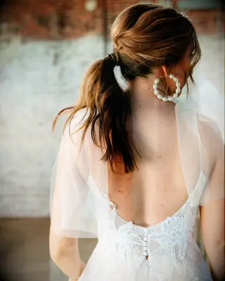 Textured ponytail wedding hairstyle