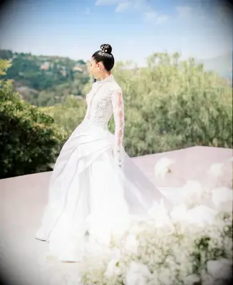 Pearl embellished top knot wedding hairstyle