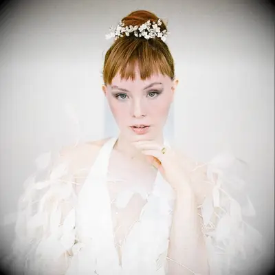 Floral bun crown wedding hairstyle