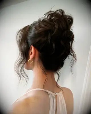 Messy wavy bun wedding hairstyle