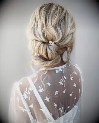 Textured And Twisted bun wedding hairstyle