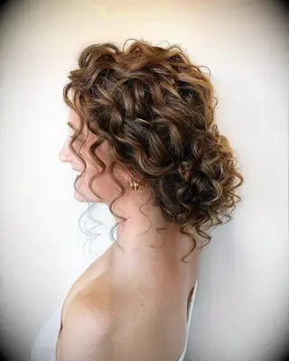 Naturally Curly Messy Bun wedding hairstyle