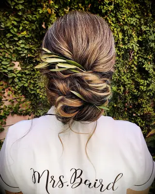 Greenery bun wedding hairstyle