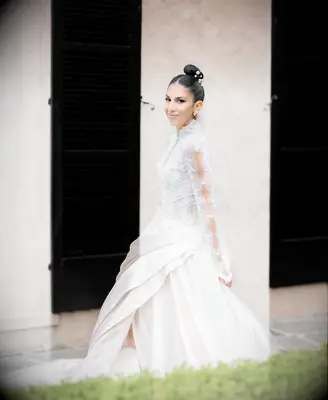 Pearl embellished top knot high neck dress wedding hairstyle