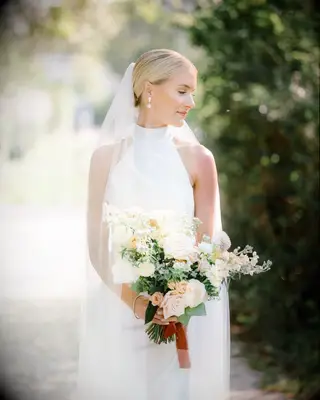 Low bun high neck dress wedding hairstyle