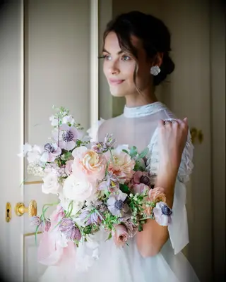 Low key bun high neck wedding hairstyle