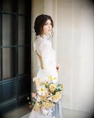 Face framing high neck wedding dress hairstyle