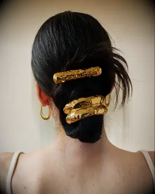 Twist with gold barrettes