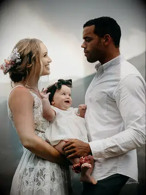 boho wedding hair low loose bun with flower barrette