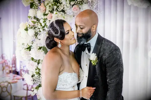 Low bun with swooping bangs wedding hairstyle