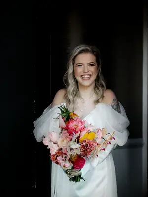 Side part and beach waves wedding hairstylist