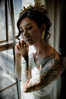 Side part updo with crown wedding hairstyle