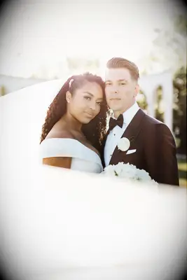 Soft curls pinned to the side wedding hairstyle