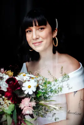 Side clip with bangs wedding hairstyle