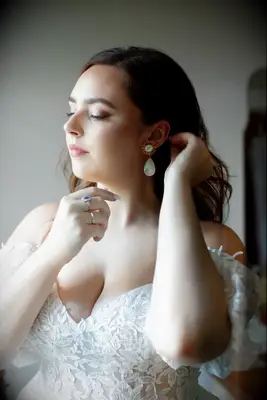 Soft blowout and side part wedding hairstyle