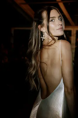 Half-up half-down formal wedding hairstyle with waves