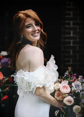 Textured low half-up formal wedding hairstyle