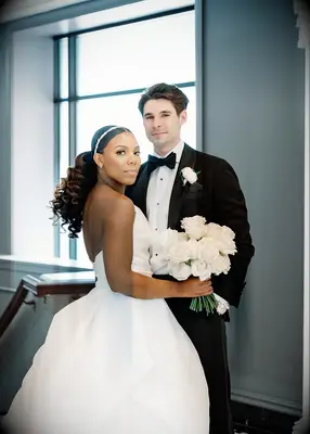 Slicked back voluminous ponytail formal wedding hairstyle